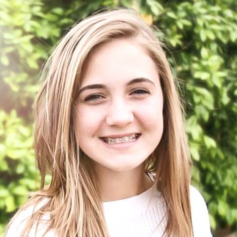 Close-up of Lexi Schultz smiling outdoors
